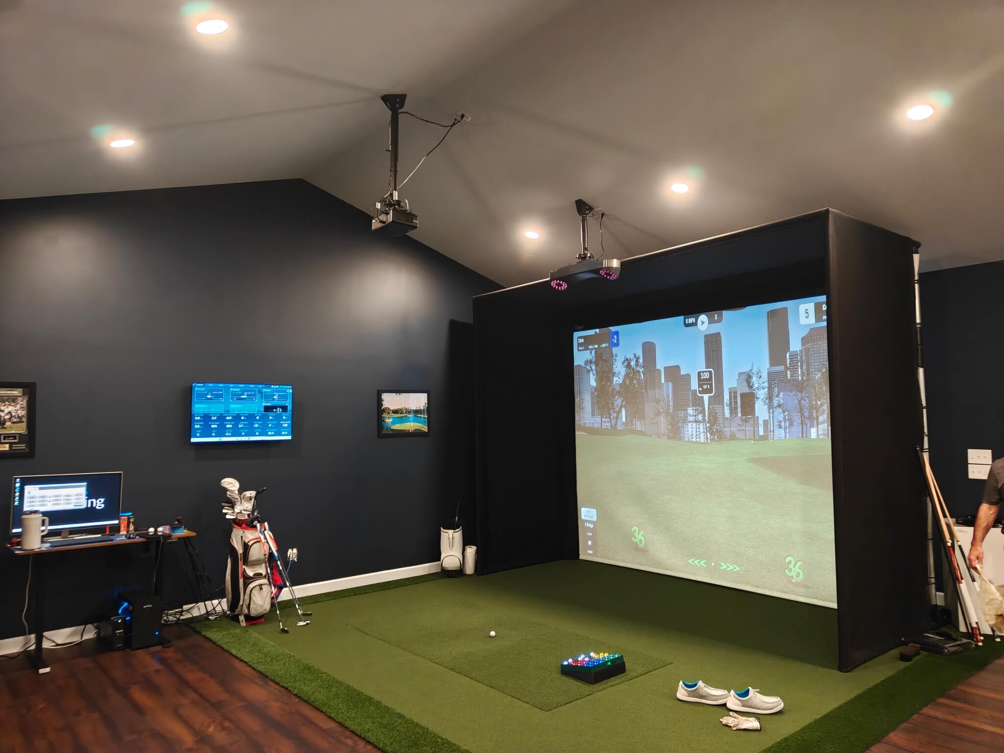 new golf simulator in an attic converted to a den